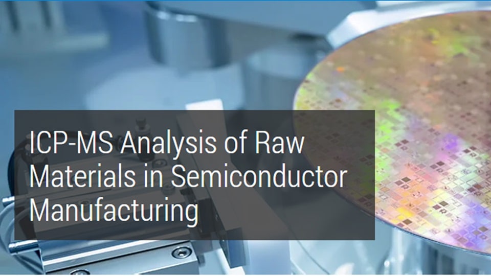 A close-up of a colorful semiconductor wafer in a lab. Text reads 